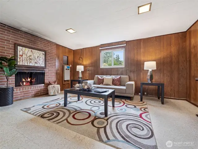 Downstairs recreational room with wood-burning fireplace