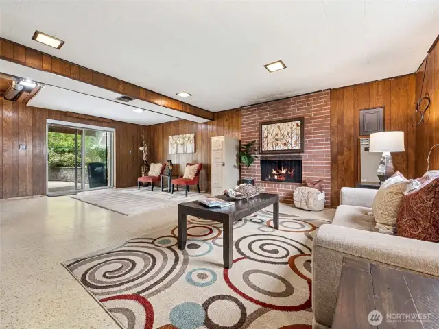 Sliding glass door accesses private patio and leads to gorgeous yard, yard shed, sitting area, access to deck.
