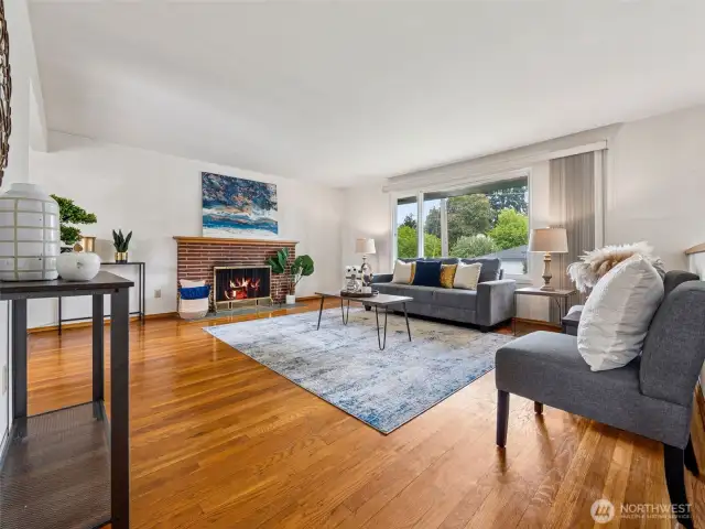 Look at these original floors just exposed to prepare for sale. Lots of natural light, vinyl windows, wood-burning fireplace.