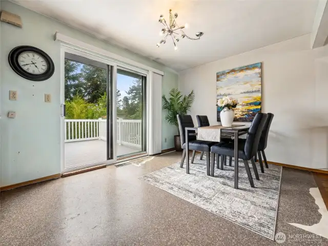 Sliding glass door to beautiful deck and back yard sanctuary.