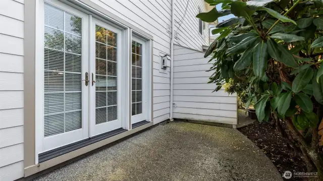 French doors lead to the private patio