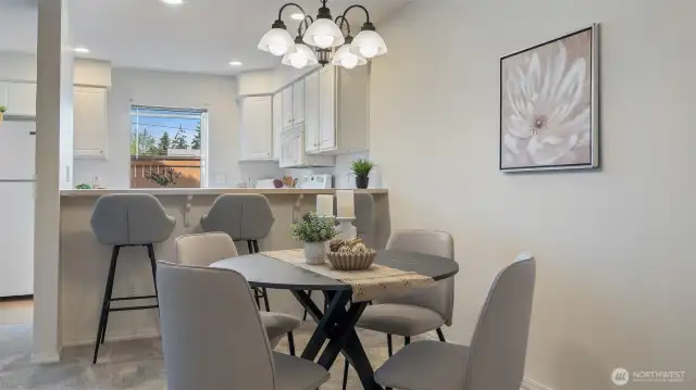 Convenient breakfast bar provides additional dining space.