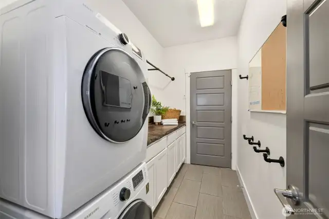 Main level utility room and door to garage