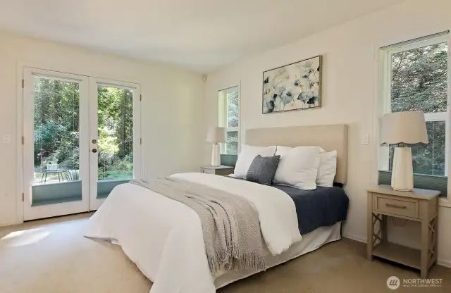 primary bedroom with french doors to patio