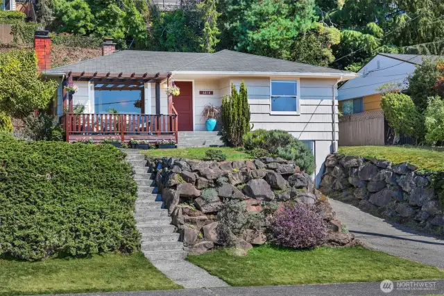 Rockery with planting and driveway to generous size garage.
