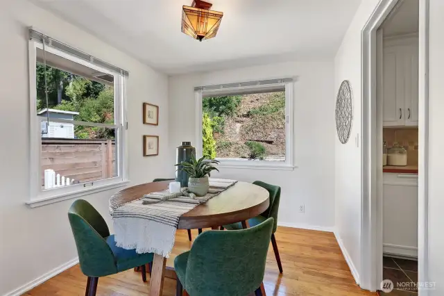 Dining area off kitchen with tons of light and view to the terraced back yard.
