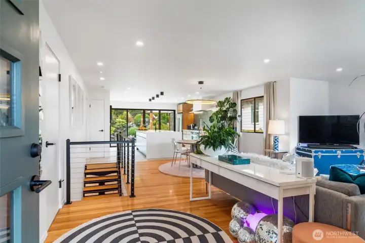 Welcome Home! Open living space with restored original red oak hardwood floors throughout.