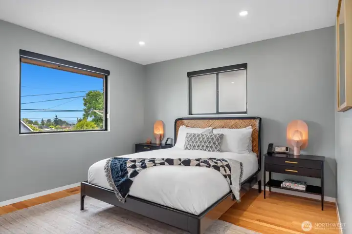 Fresh with window and lighting updates for a sweet slumber in the primary suite.