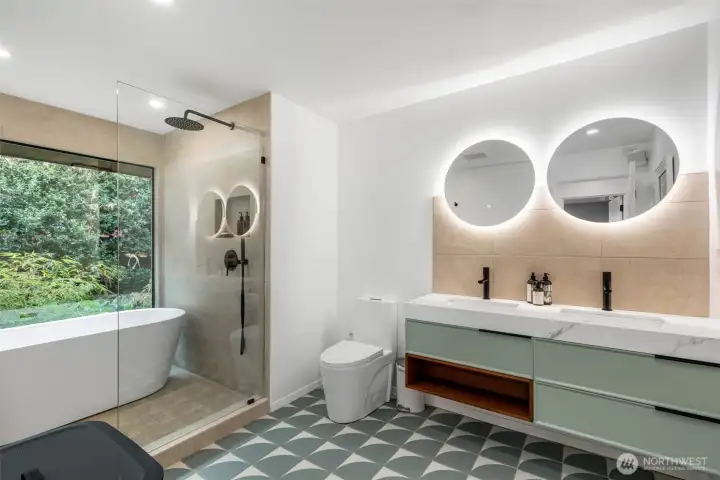 Owners suite with walk in closet and luxurious bathroom with freestanding tub in front of a custom picture window overlooking bamboo in the garden. Underfloor heating too.