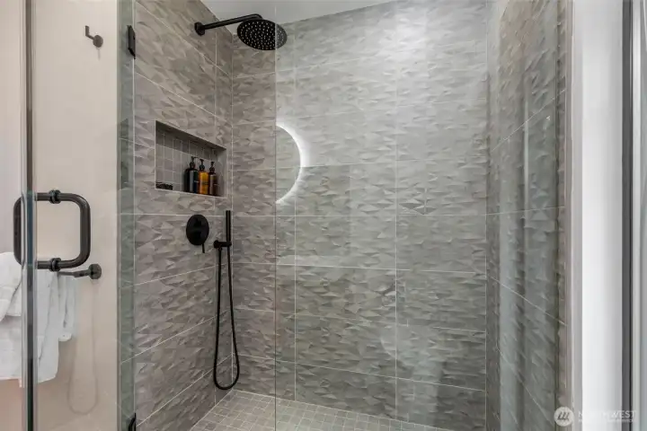 Beautifully renovated bathroom on the main floor for guests to use.