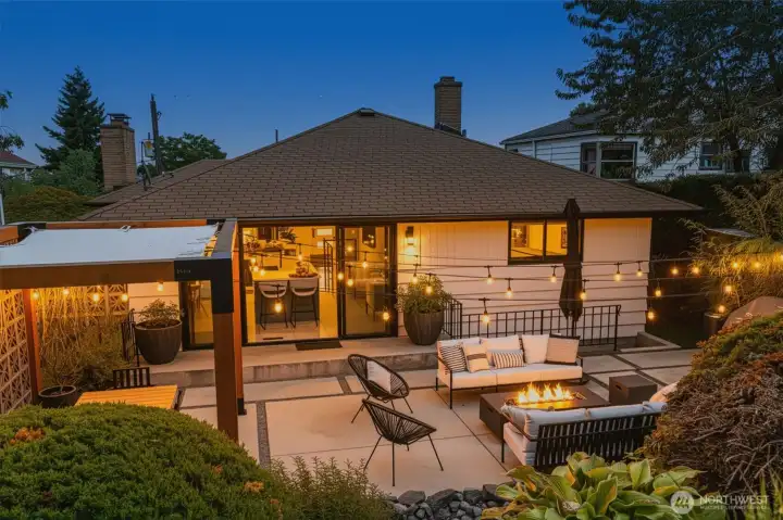 Full landscape renovation with hot tub, shed, outdoor power supply, grow beds, custom gazebo, waterfall, entry gates and light fixtures.