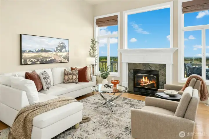 Gas fireplace with a wall of windows.