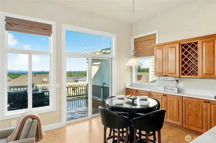 Dining nook off kitchen leads to 600sf deck with entertaining lights and hot tub!