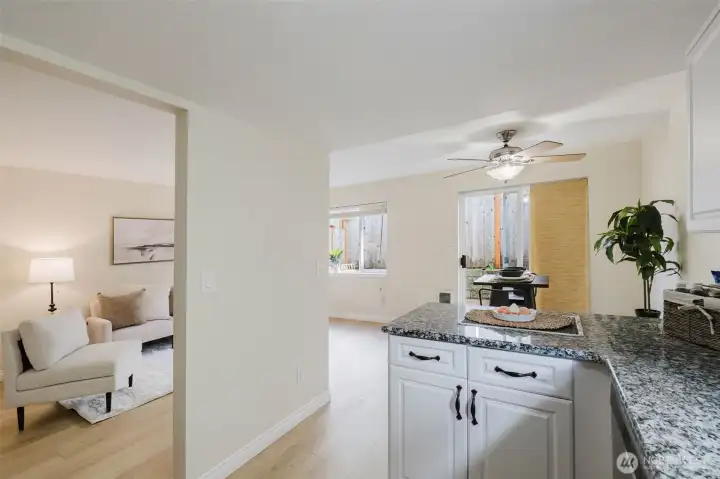 Kitchen looking at living room and dining area