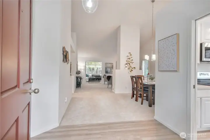 Beautiful entry! New LVP flooring, new carpeting, new interior paint. New entry light fixture.