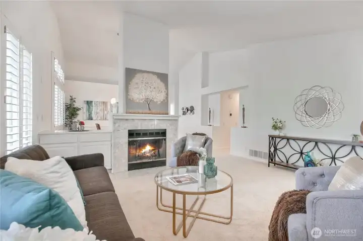 Marble faced gas fireplace and buffet.