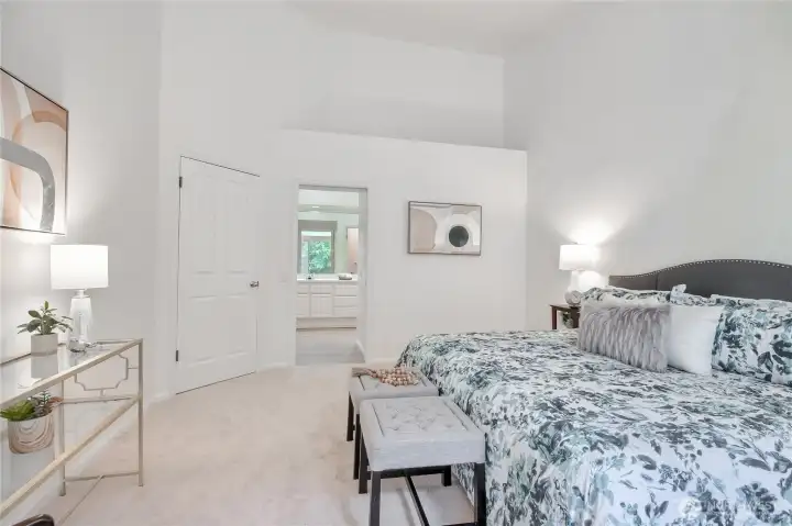 Primary bedroom ensuite with high ceilings.