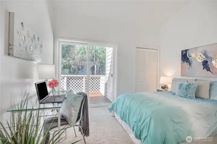 2nd bedroom with sunny deck and steps to back area.