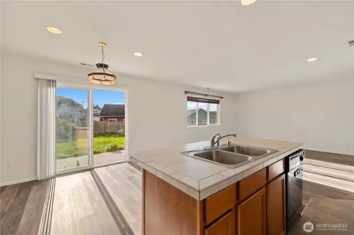 Kitchen opens to the back patio, great for entertaining, and brings in lots of natural light.