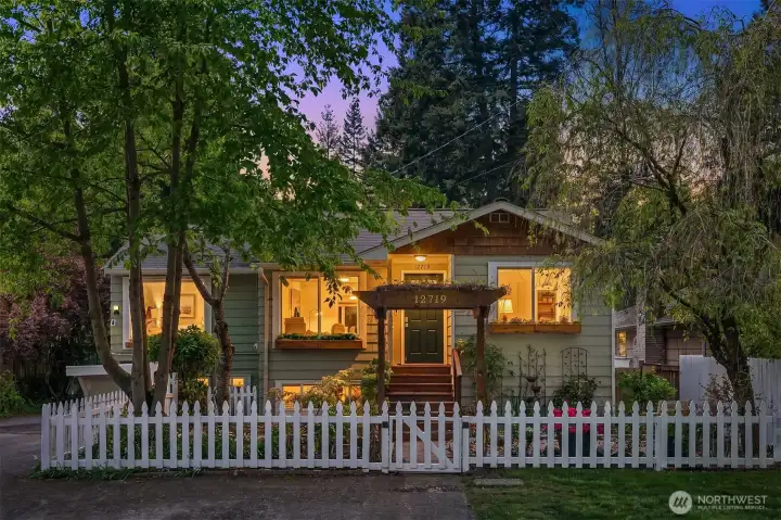 Front of home with white picket fence