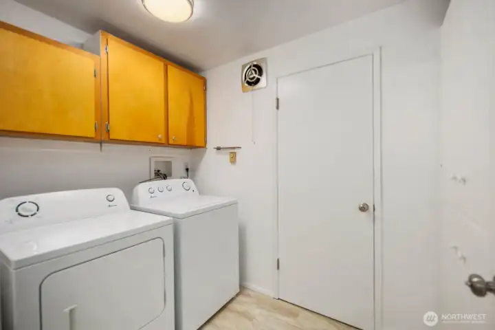 Convenient Utility Room, Quietly Insulated.