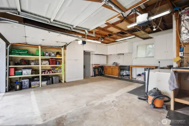 Two Car Garage with Tons of Storage and Work Bench.