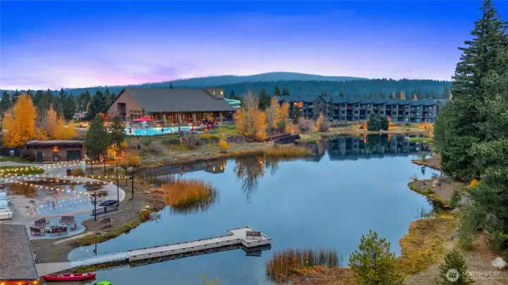 Scenic aerial view overlooking the tranquil resort lake at dusk.