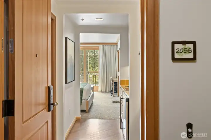 Welcoming entry hall with warm wood tones and clean, updated finishes.