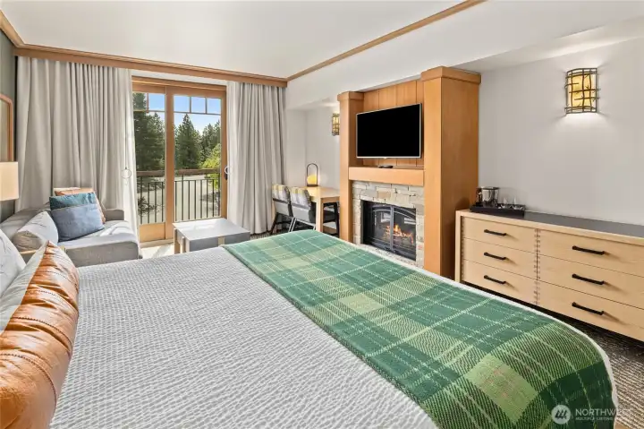 Plush bed paired with warm textures for a restful retreat.