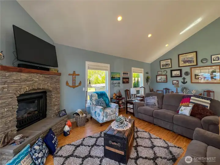 Beautiful stacked stone gas fireplace complete with hearth.