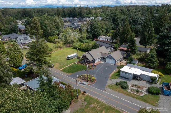 Aerial photo of the house and garage.