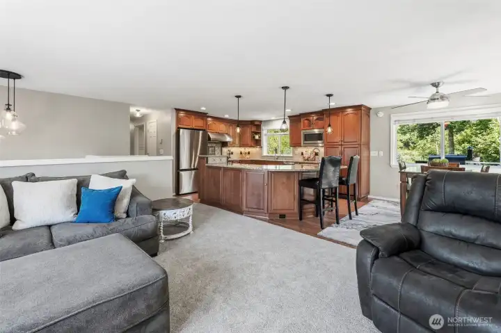 Open-concept living area offering multiple gathering spaces, ideal for everyday living and entertaining guests.
