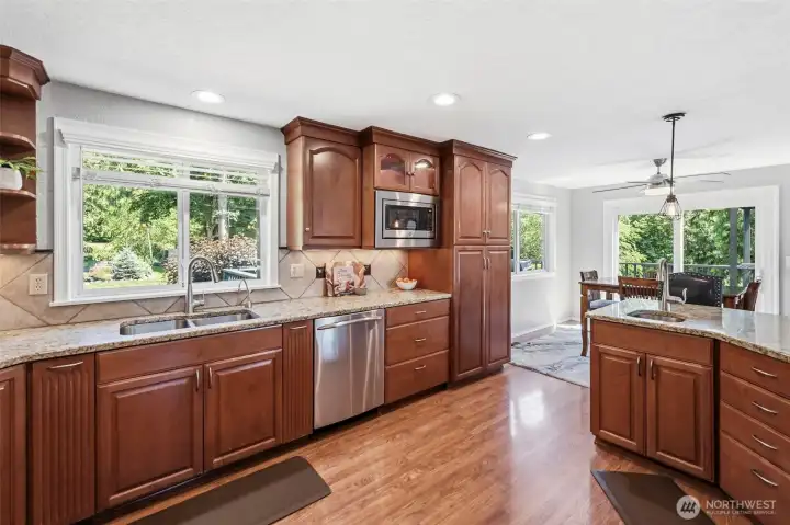 Spacious kitchen featuring abundant storage, generous workspace, and seamless flow into the dining area.