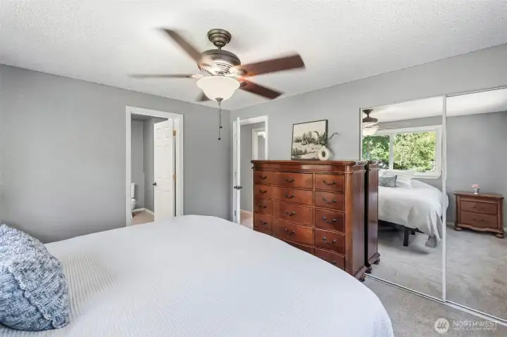 Spacious primary suite with ample room for furniture, generous closet space, and an attached bath for added convenience.