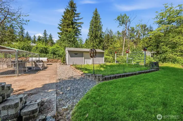 Expansive backyard with level lawn, garden space, and room for pets, recreation, and outdoor enjoyment in Fairway Hills.