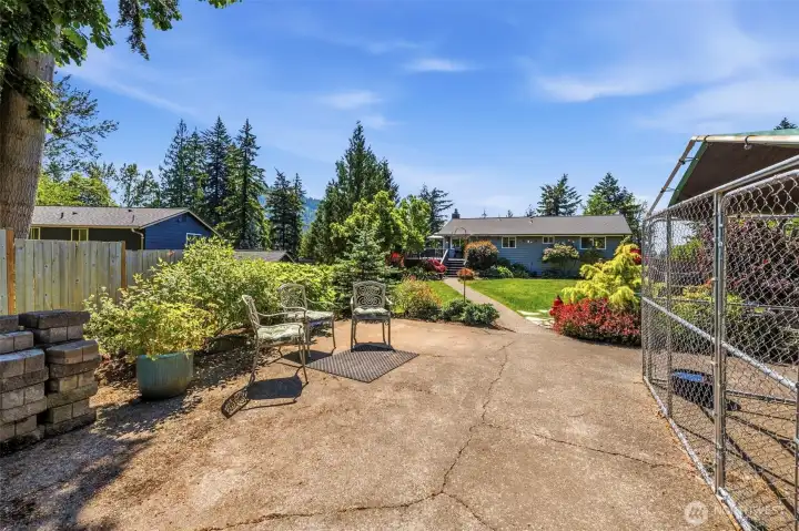 Detached small shop and garden area offer valuable space for projects, storage, hobbies, and outdoor living rarely found in town.