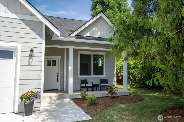 A sweet covered front porch with only 1-step allows easy entry into the home—no long flights of stairs to climb.