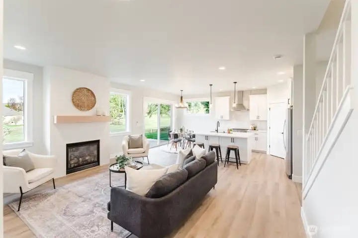 The spacious living room is open to the kitchen & dining, allowing everyone to easily gather together.