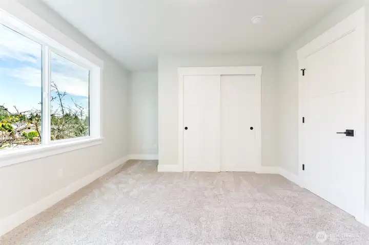 Bedroom 3 is upstairs with a generous closet and large window—great as a bedroom, playroom, or second office.