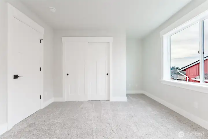 Bedroom 4 is light, airy with plush carpet and a full closet—perfect for guests, kids, or a quiet hobby room.
