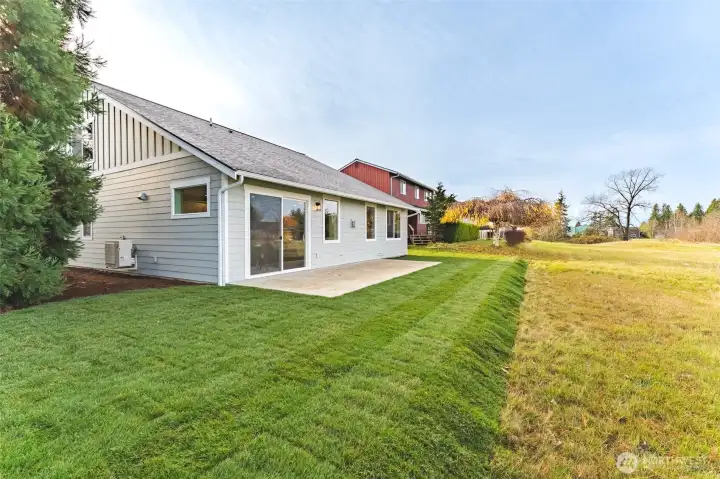 Level backyard backing to open greenspace—ideal for relaxing, playing, or walking pets.