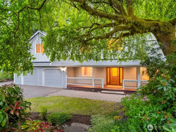 PEEKING THROUGH THE TREES | This home is screened from the cul-de-sac by beautiful landscaping.