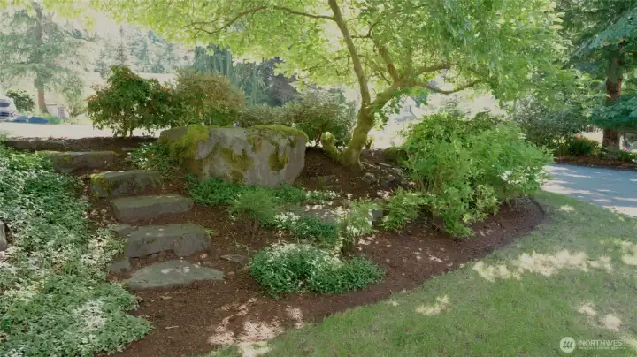 VIEW FROM THE PORCH | You'll fall in love with the natural beauty of the landscaping.