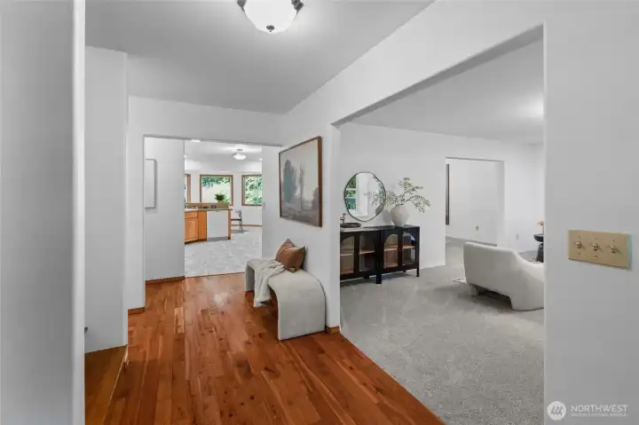 ENTRY WITH STYLE | The beautiful hardwood floor draws your eye into the home and straight out to the windows in the kitchen at the back of the home. The flow in this home is such a beautiful change of pace from the open concept warehouse floorplan. Each room has a defined purpose, but connects effortlessly to the adjoining spaces.