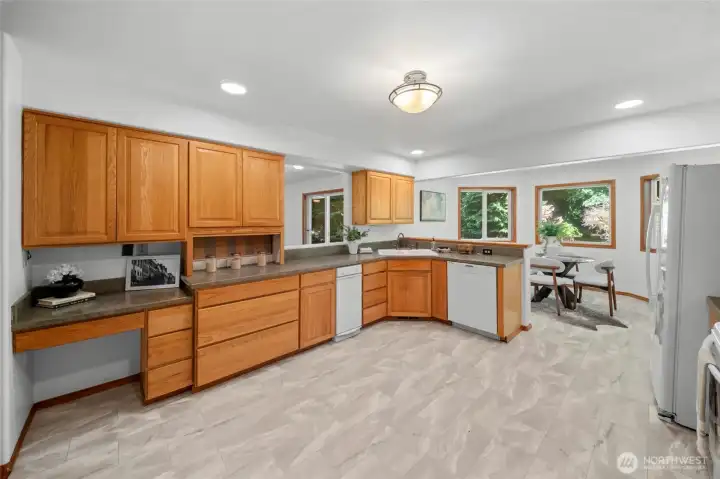 KITCHEN | Fresh and functional. With new vinyl on the floor and fresh paint throughout, this kitchen with eat-in area is the perfect starting point to layer on some upgrades to suit your taste.