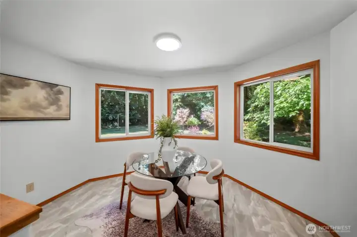 KITCHEN EAT-IN AREA | Enjoy multiple dining areas in this home. This bright spot features windows that let you take in the beauty of the backyard while enjoying your morning coffee.