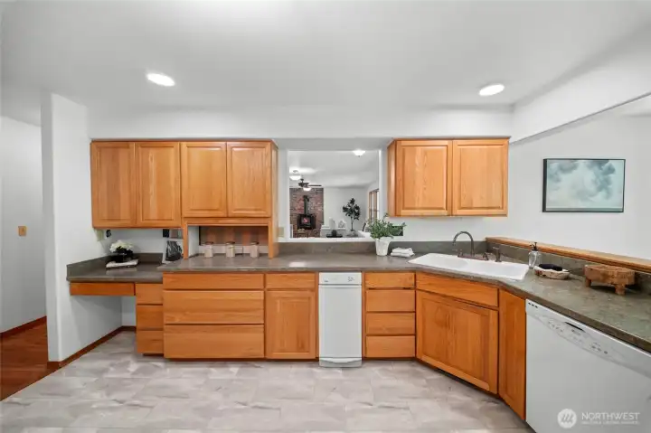 KITCHEN | Entertaining in the family room? Then you'll love the convenient kitchen pass-through with a counter on the other side that's the perfect spot for snacks and beverages.