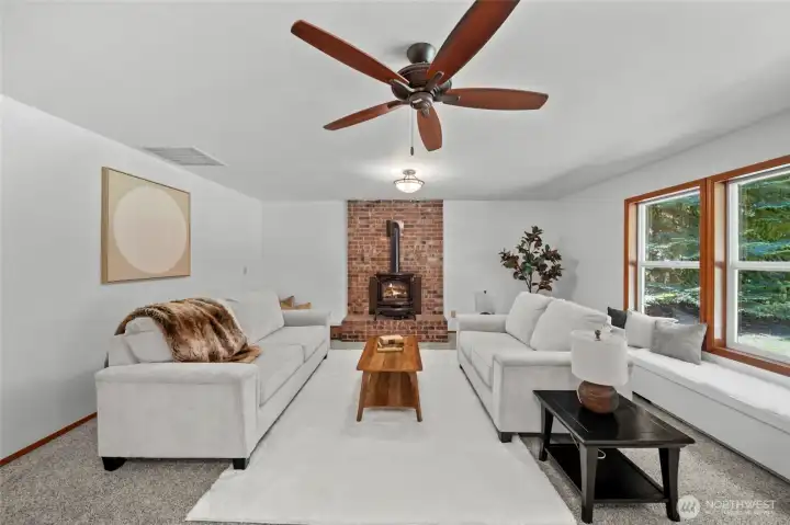 FAMILY ROOM | With an abundance of windows and a cozy fireplace, this is a room you'll love to live in.