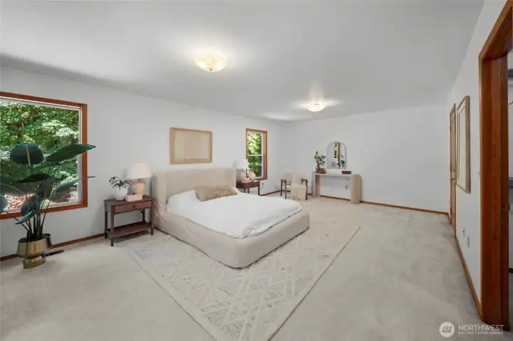 PRIMARY SUITE | This bedroom is huge! With two walk-in closets and multiple windows overlooking the backyard, you'll be enchanted with this room.