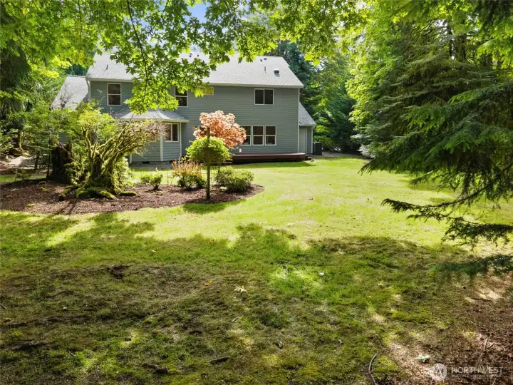 BACKYARD BEAUTY | This property features peaceful park-like natural landscaping for low maintenance.